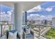 Spacious balcony with city views and comfortable seating at 301 Quay Commons # 1406, Sarasota, FL 34236