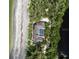 Bird's-eye view of beachfront home showcasing unique architecture at 8440 Sanderling Rd, Sarasota, FL 34242