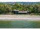 Aerial view of a luxurious beachfront home at 8440 Sanderling Rd, Sarasota, FL 34242