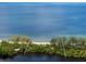 Aerial view of waterfront home with beach access at 8440 Sanderling Rd, Sarasota, FL 34242
