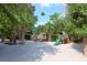 playground with wooden playset and swings at 8440 Sanderling Rd, Sarasota, FL 34242