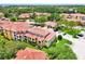 Community overview showcasing building exteriors, landscaping, and parking at 5551 Bentgrass Dr # 11-103, Sarasota, FL 34235