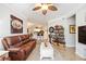 Living room with leather couches and a large TV at 5122 Northridge Rd # 107, Sarasota, FL 34238