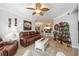 Living room with brown leather couches and a coffee table at 5122 Northridge Rd # 107, Sarasota, FL 34238