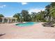 Resort-style pool with lounge chairs and a pergola at 5122 Northridge Rd # 107, Sarasota, FL 34238