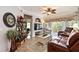 Living room with leather furniture, decorative rug, and access to balcony at 5122 Northridge Rd # 107, Sarasota, FL 34238
