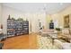 Community room with hardwood floors, a large bookcase, and seating area at 5122 Northridge Rd # 107, Sarasota, FL 34238