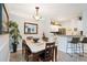 Bright dining room features a table with six chairs and a view into the living room at 5122 Northridge Rd # 107, Sarasota, FL 34238
