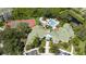 Aerial view showing clubhouse, pool, and tennis court at 5122 Northridge Rd # 107, Sarasota, FL 34238