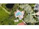 Aerial view of condo community, highlighting the pool and tennis court at 5122 Northridge Rd # 107, Sarasota, FL 34238