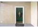 Private condo entrance with a lovely door and welcome mat at 5122 Northridge Rd # 107, Sarasota, FL 34238