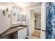 Spacious bathroom with granite vanity, and access to laundry room at 5122 Northridge Rd # 107, Sarasota, FL 34238