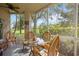 Cozy screened porch with seating area, perfect for relaxing outdoors at 5122 Northridge Rd # 107, Sarasota, FL 34238