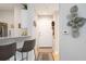 Bright and airy entryway with tile flooring and modern wall decor at 5122 Northridge Rd # 107, Sarasota, FL 34238