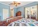 Bedroom featuring hardwood floors, access to the porch and a view into the hallway at 7602 Partridge Street Cir, Bradenton, FL 34202