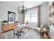Bright home office featuring a large desk and wood cabinetry at 9949 Key Haven Rd, Seminole, FL 33777