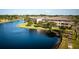 Lake and community building view at 9947 Key Haven Rd, Seminole, FL 33777