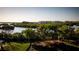 Waterfront view of calm waters, mangroves, and distant condo buildings at 9961 Key Haven Rd, Seminole, FL 33777