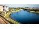 Community lake view with surrounding condos at 9949 Key Haven Rd, Seminole, FL 33777