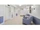Lobby area with elevators and comfortable seating for residents at 409 N Point Rd # 502, Osprey, FL 34229