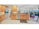 Open kitchen features granite counters, ample cabinetry, and views to living area at 409 N Point Rd # 502, Osprey, FL 34229