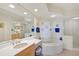 Elegant bathroom with a soaking tub and walk-in shower at 409 N Point Rd # 502, Osprey, FL 34229