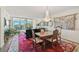 Dining room with antique furniture and a view to the living room at 409 N Point Rd # 502, Osprey, FL 34229