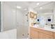 Bathroom with a large vanity, walk-in shower and tiled walls at 409 N Point Rd # 502, Osprey, FL 34229
