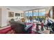 Spacious living room with balcony access and scenic view at 409 N Point Rd # 502, Osprey, FL 34229