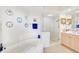 Spa-like bathroom with soaking tub, walk-in shower, and vanity at 409 N Point Rd # 502, Osprey, FL 34229