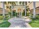 Elegant courtyard entrance with a fountain at 409 N Point Rd # 502, Osprey, FL 34229