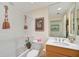 Well-appointed bathroom with a bathtub and updated fixtures at 409 N Point Rd # 502, Osprey, FL 34229