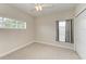 Bedroom with carpet flooring, window and double door closet at 337 Snapdragon Loop, Bradenton, FL 34212