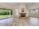 Bright Gathering room featuring a stone fireplace and access to the backyard at 337 Snapdragon Loop, Bradenton, FL 34212