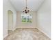 Spacious dining area with tile flooring and a charming chandelier at 337 Snapdragon Loop, Bradenton, FL 34212