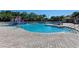 Large community pool with a separate kiddie pool and plenty of lounge chairs at 337 Snapdragon Loop, Bradenton, FL 34212