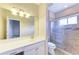 Bathroom boasts a large vanity, tiled shower, and updated fixtures at 337 Snapdragon Loop, Bradenton, FL 34212