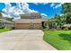 Two-story home with three-car garage and landscaped yard at 337 Snapdragon Loop, Bradenton, FL 34212