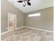 Spacious bedroom with tile flooring and access to bathroom at 337 Snapdragon Loop, Bradenton, FL 34212