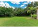 Spacious backyard with lush lawn and natural landscaping at 337 Snapdragon Loop, Bradenton, FL 34212