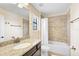 Bathroom with granite countertop and tub at 8104 36Th E St, Sarasota, FL 34243