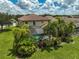 Aerial view of a home with a pool and lush tropical landscaping at 8104 36Th E St, Sarasota, FL 34243