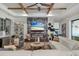 Cozy living space with a modern fireplace feature wall, chic decor, and views into the home at 13212 Deep Blue Pl, Lakewood Ranch, FL 34211