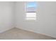 Empty bedroom with tiled floor and window at 223 Rio De Janeiro Ave, Punta Gorda, FL 33983