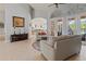 Spacious living room featuring tile floors and French doors to an outdoor patio at 2330 Little Country Rd, Parrish, FL 34219