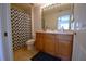 Clean bathroom with shower/tub combo, wood vanity, and tile floor at 11464 52Nd E Ct, Parrish, FL 34219