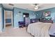 Bright bedroom featuring a plush bed, ample closet space, and a modern TV at 7407 64Th E St, Palmetto, FL 34221