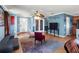 Bright living room with comfy seating, a large TV and a calming blue wall at 7407 64Th E St, Palmetto, FL 34221