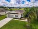 Single-Gathering home with a two-car garage and a well-maintained lawn at 7407 64Th E St, Palmetto, FL 34221