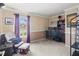 Home office with built-in shelving, a comfortable chair, and two computer monitors at 7407 64Th E St, Palmetto, FL 34221